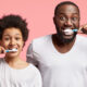 Image of father and son brushing teeth after asking "Do I need a new toothbrush?"