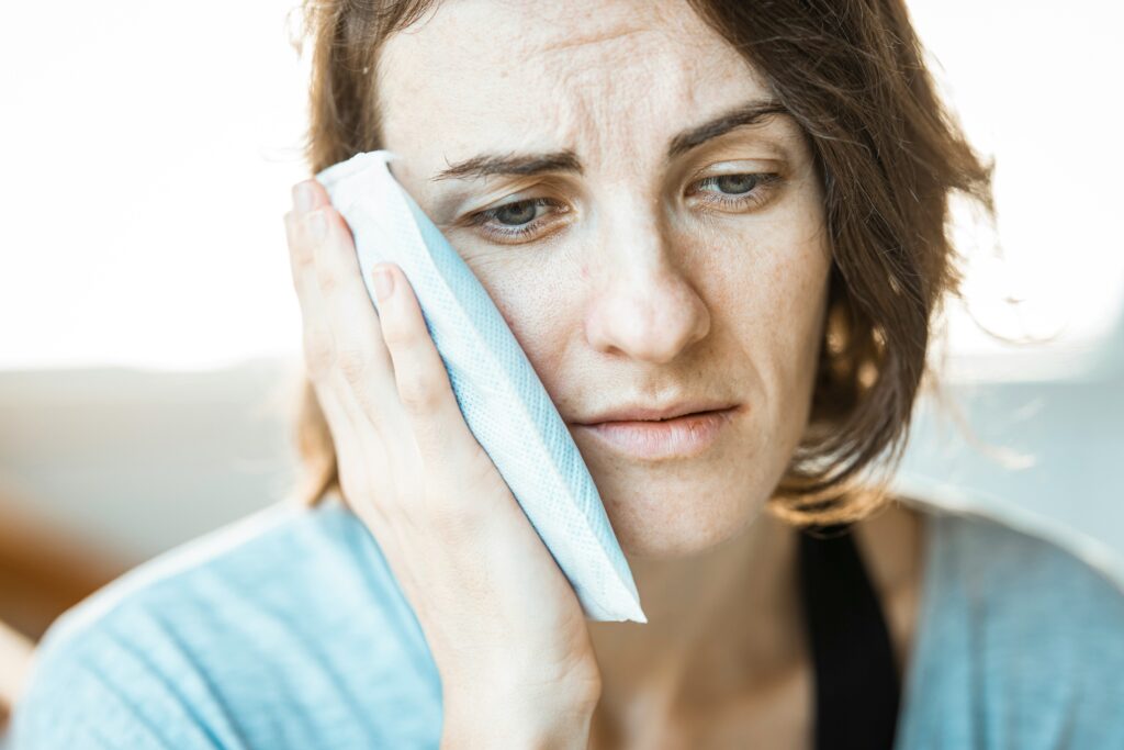 woman suffering from tooth pain